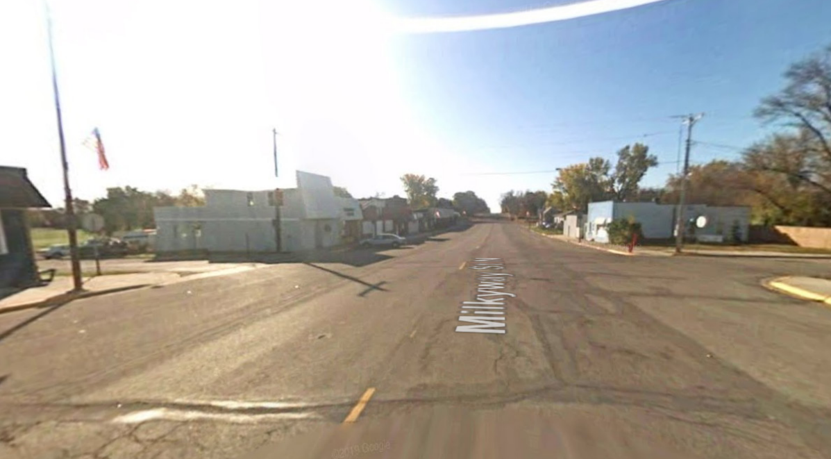 Highway 4 in Cosmos, MN before construction, showing an intersection with wide travel lanes and no crosswalks