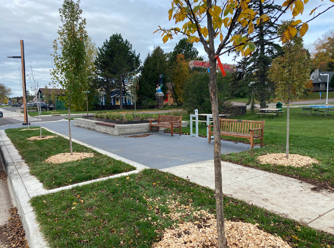 Hwy 61 and West First Street in Grand Marais after construction showing plantings and benches