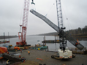 Lifting footing drill shaft into place