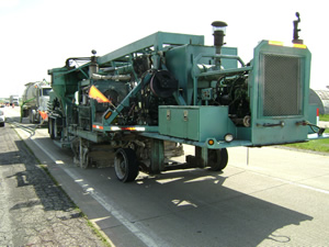 Concrete grinder used to level the road