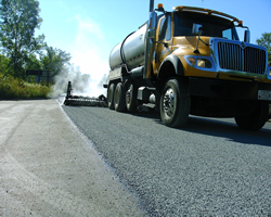 Truck performing chip sealing