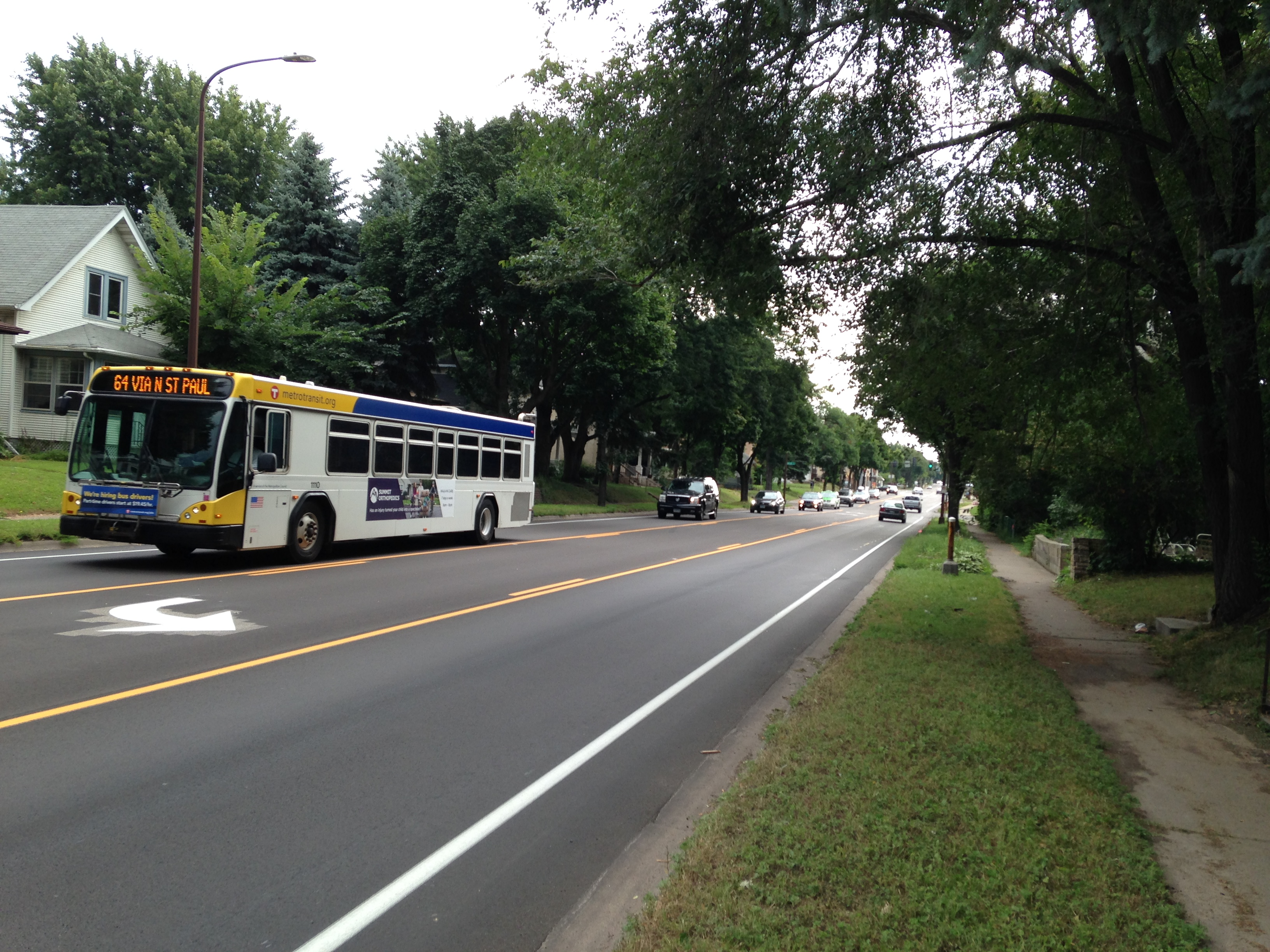 the road after construction with two travel lanes and a center turn lane